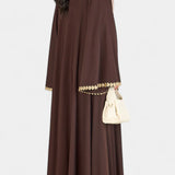 GINEBRA ABAYA FLUIDA CON BORDADO DORADO